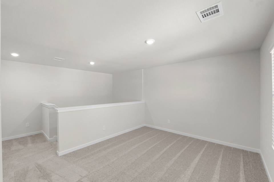 A room with a white wall and a white floor.