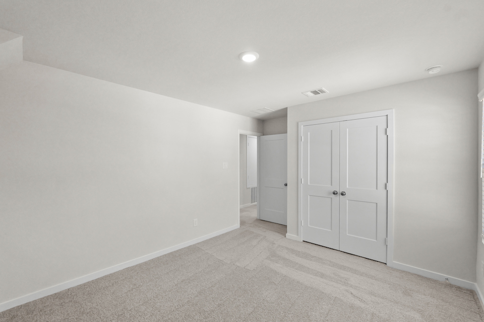 A room with white doors.