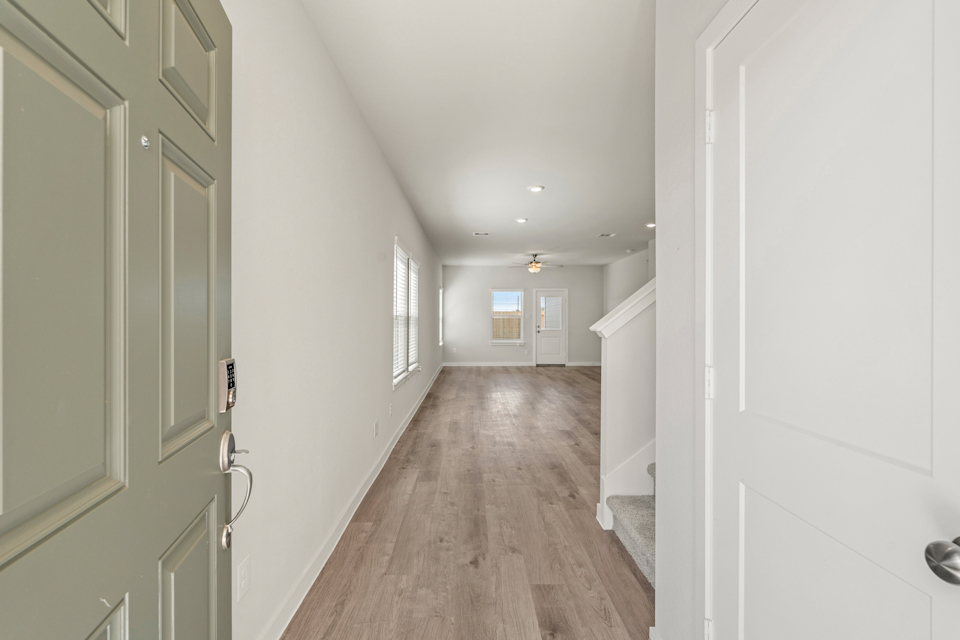 A hallway with white doors.