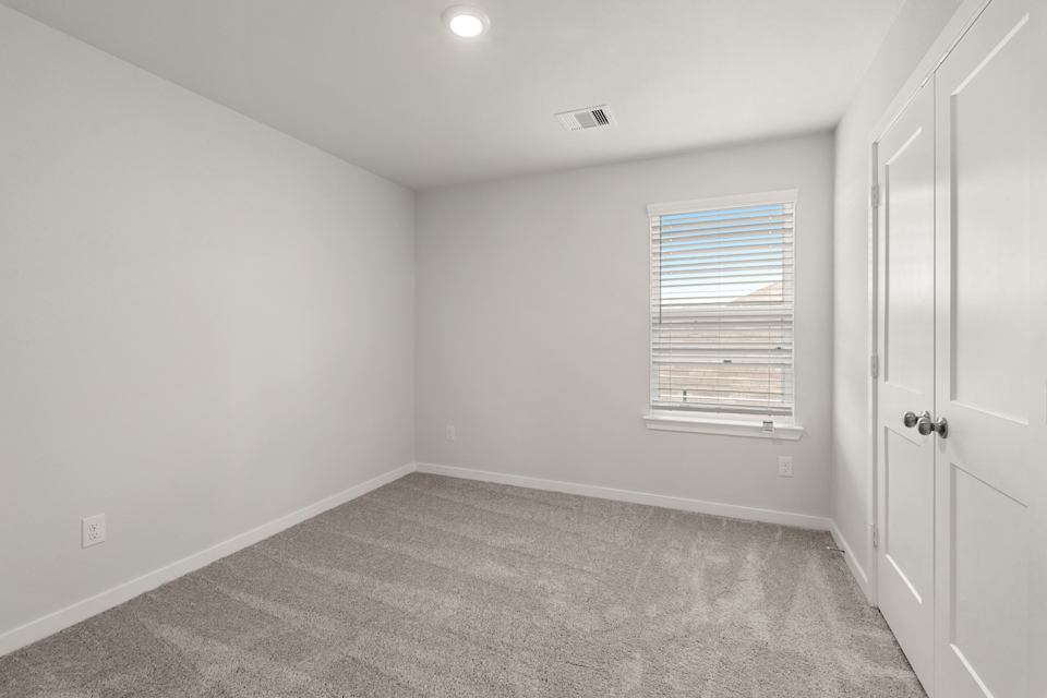 A room with a door and a window.