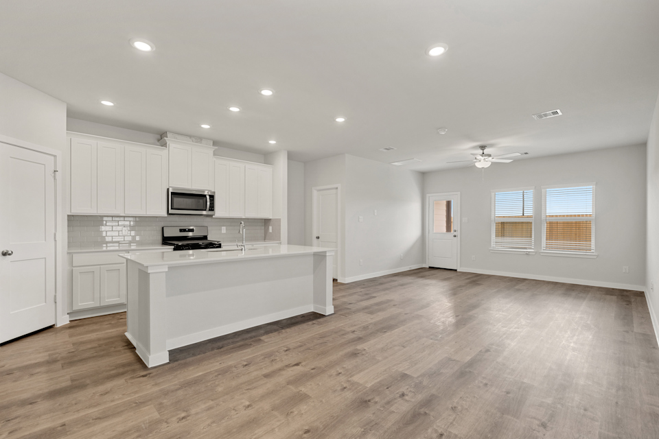 A large kitchen with white cabinets.
