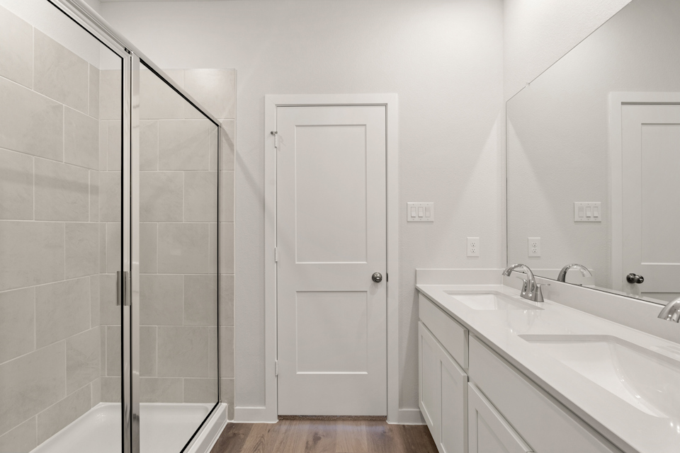 A bathroom with a glass shower.