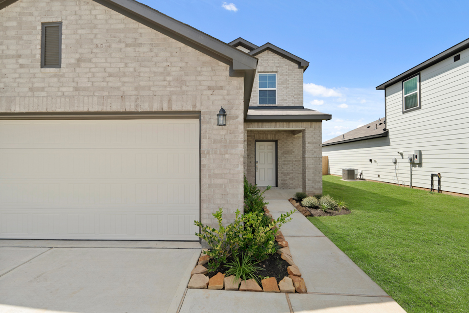 A building with a grass lawn.