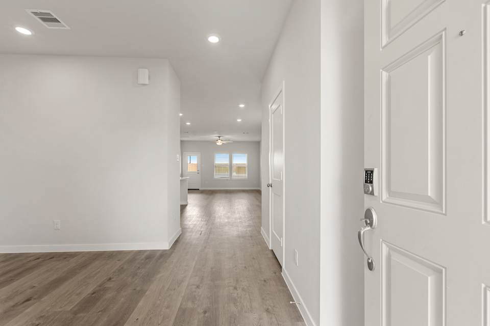 A hallway with white walls.