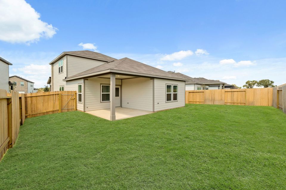 A house with a fence around it.