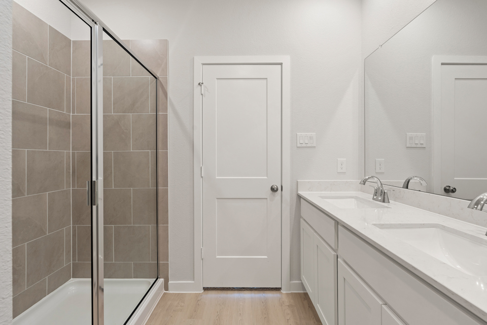 A bathroom with a glass shower.