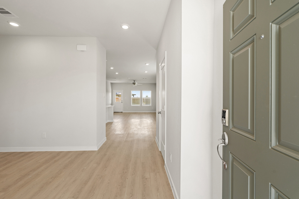 A hallway with white walls.