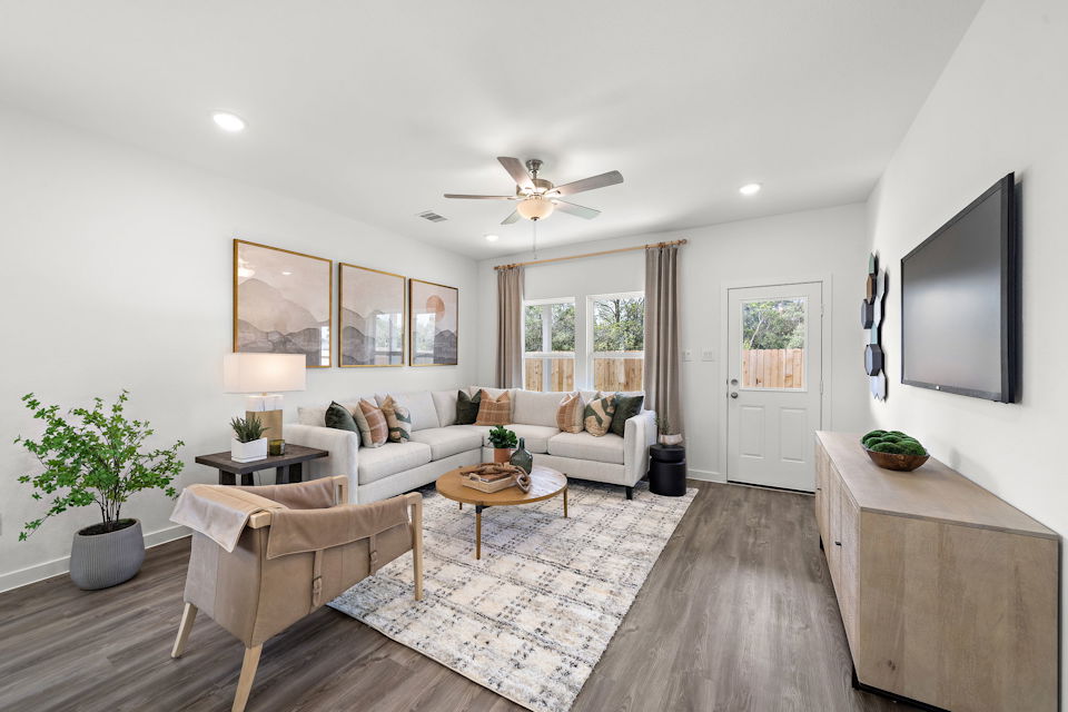 A living room with a couch and a table.