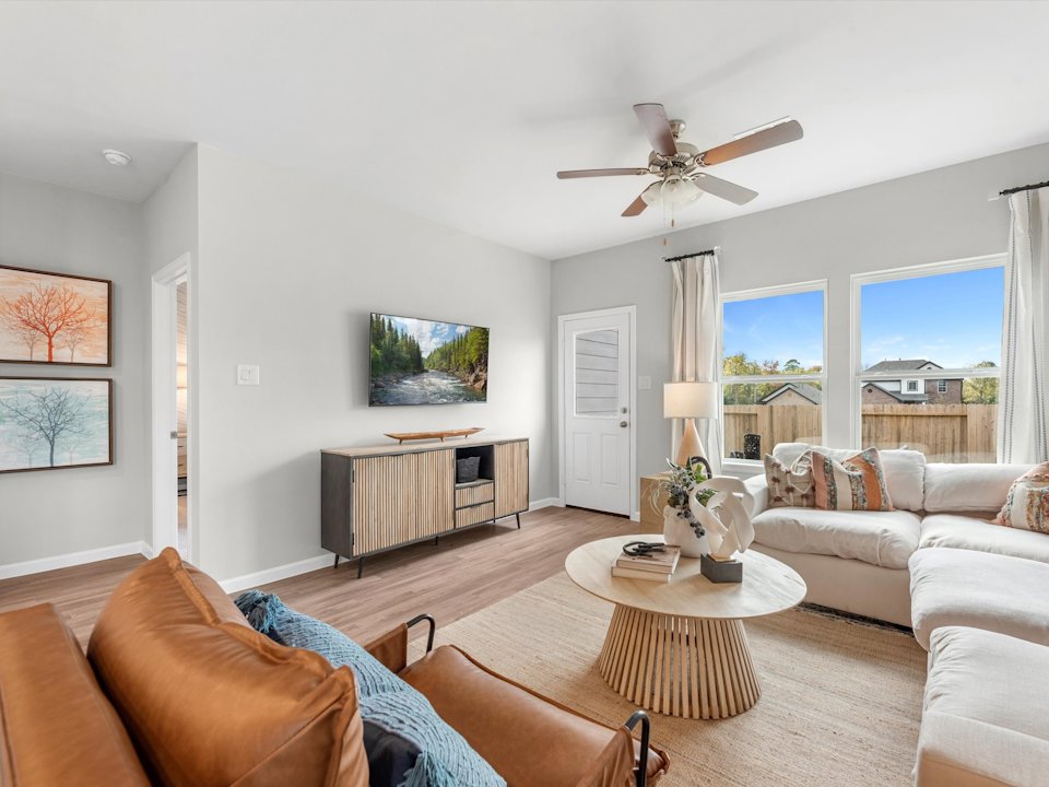 A living room with a large window.