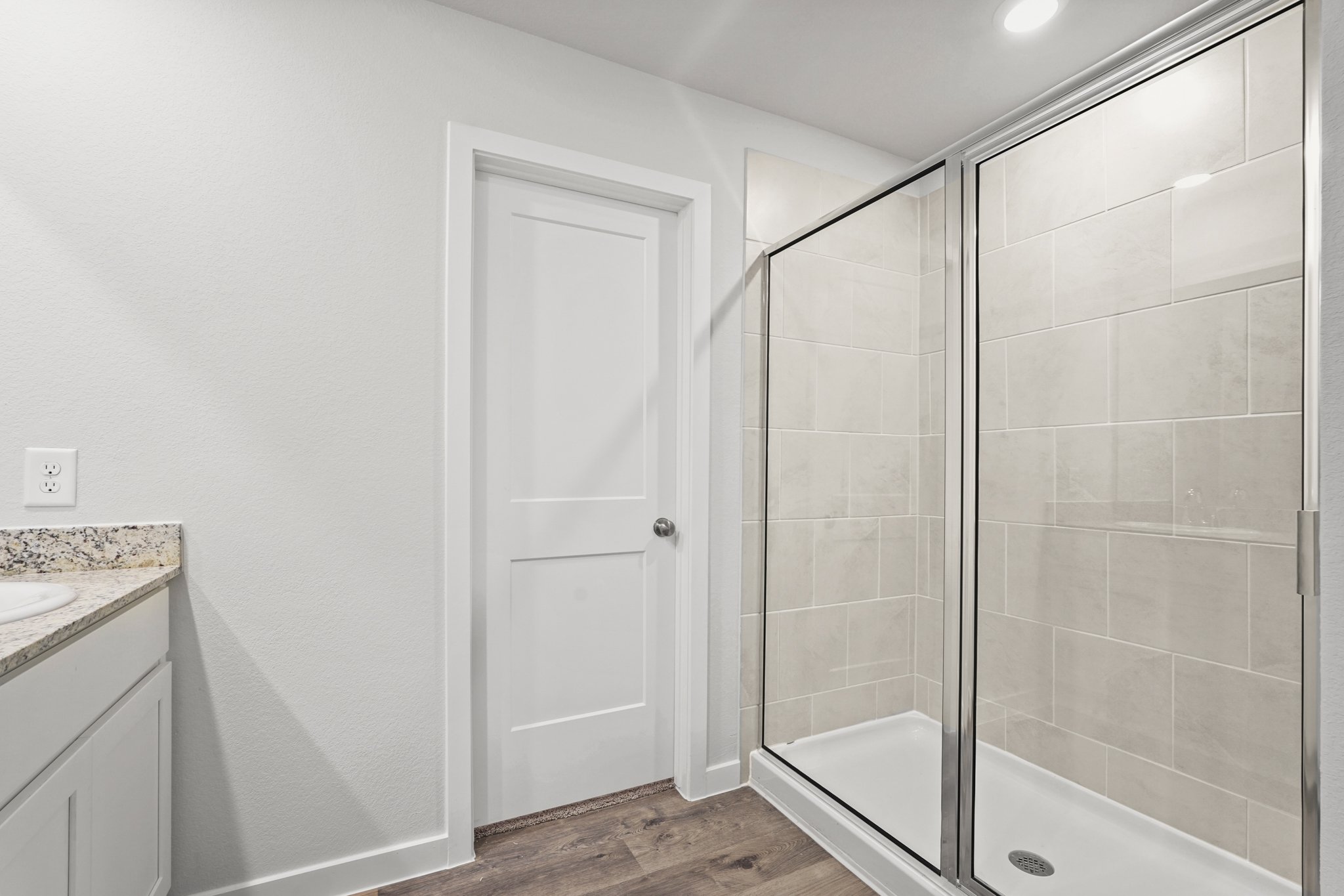 A bathroom with a glass shower.