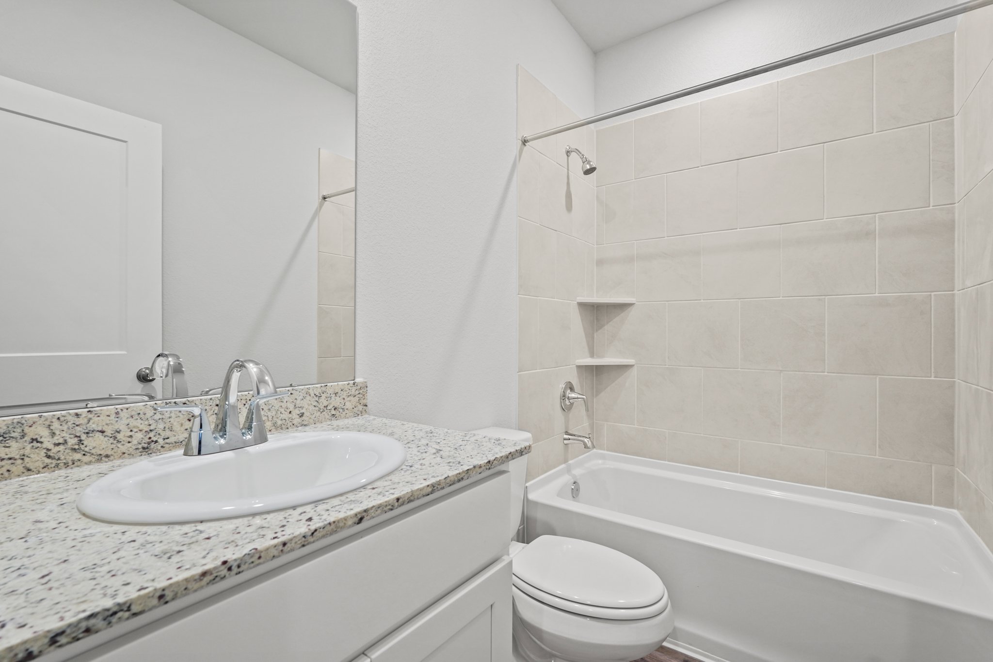 A bathroom with a sink and a tub.