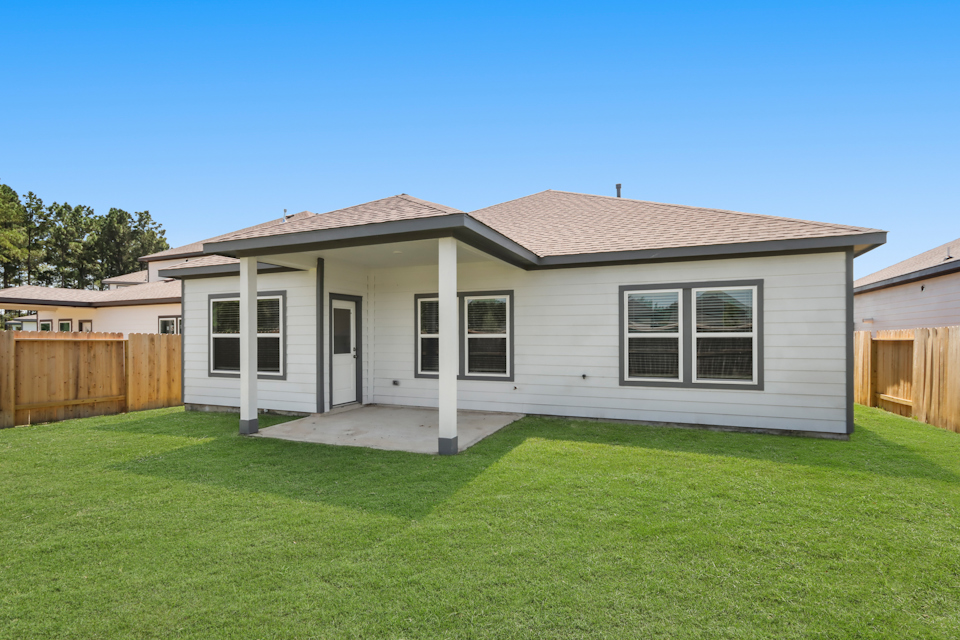 A house with a green lawn.