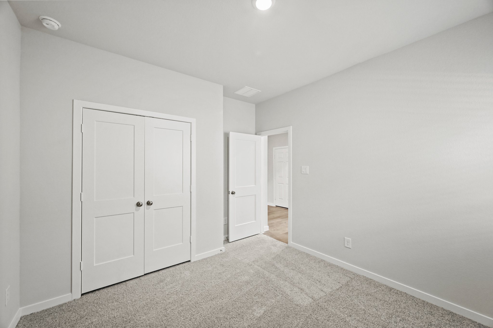 A room with white doors.