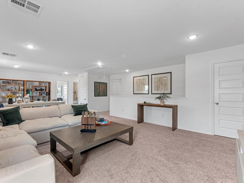 A living room with a couch and a coffee table.