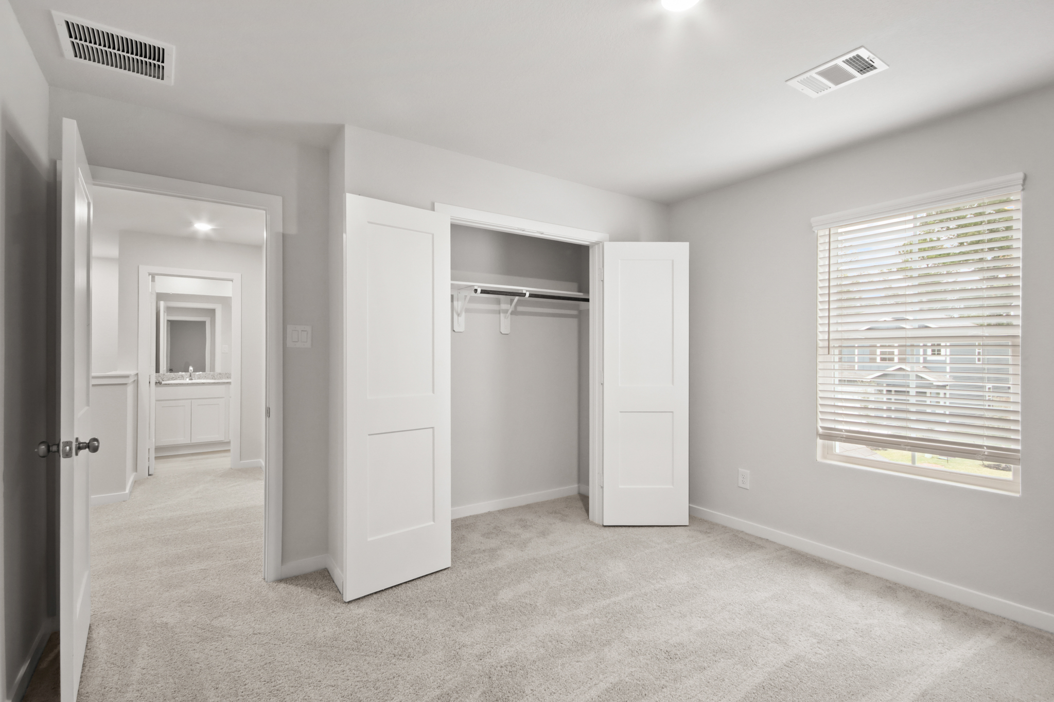 A room with white cabinets.