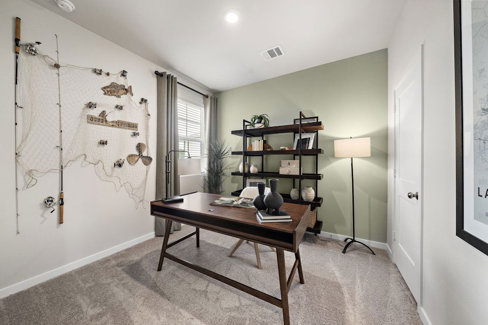 A room with a table and shelves.