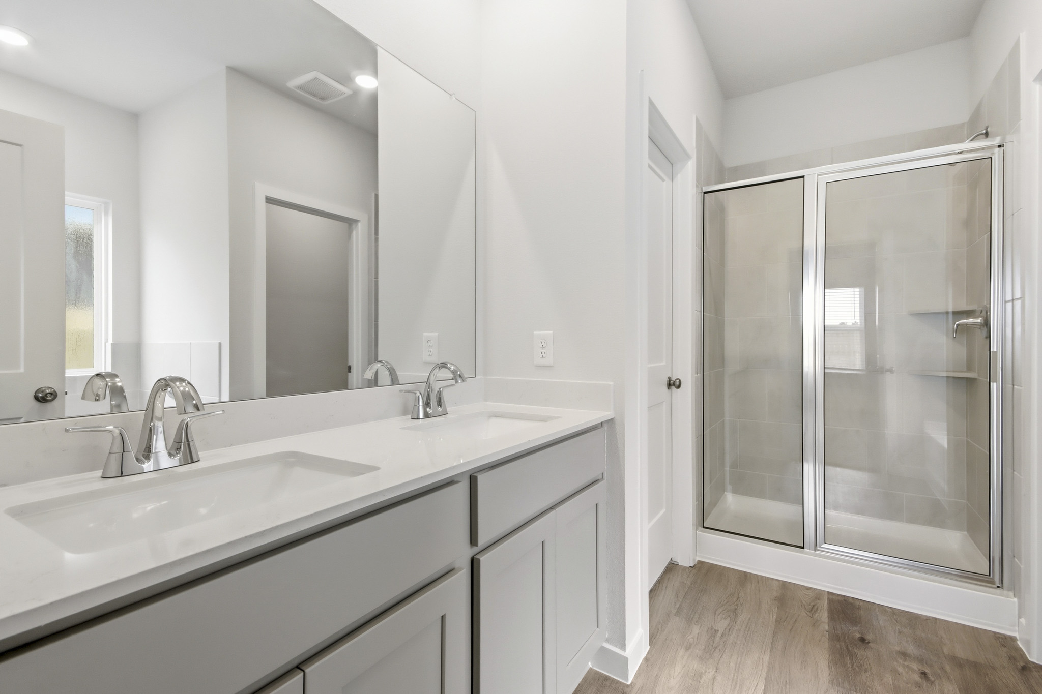 A bathroom with a glass shower.