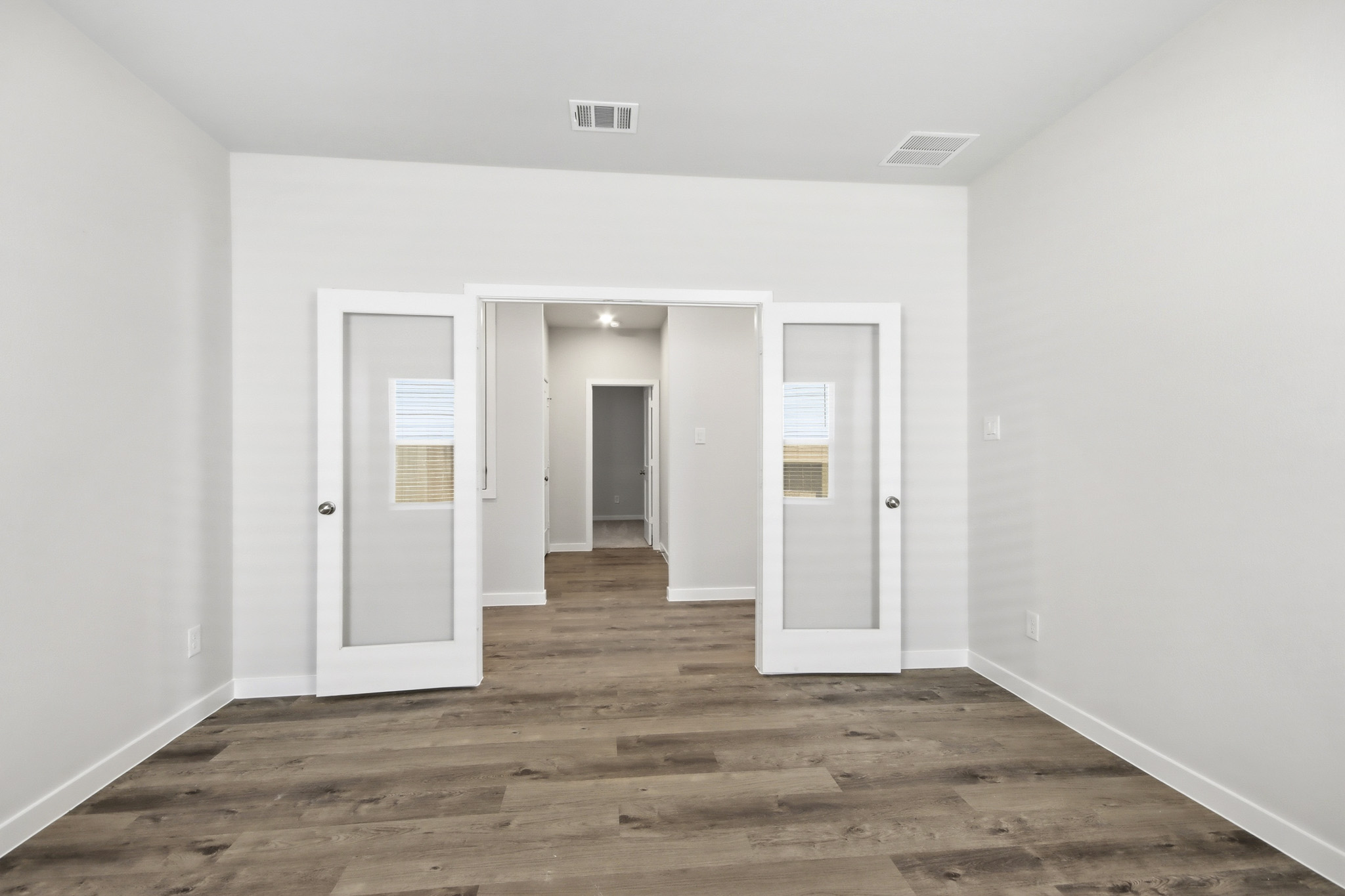 A room with white doors.