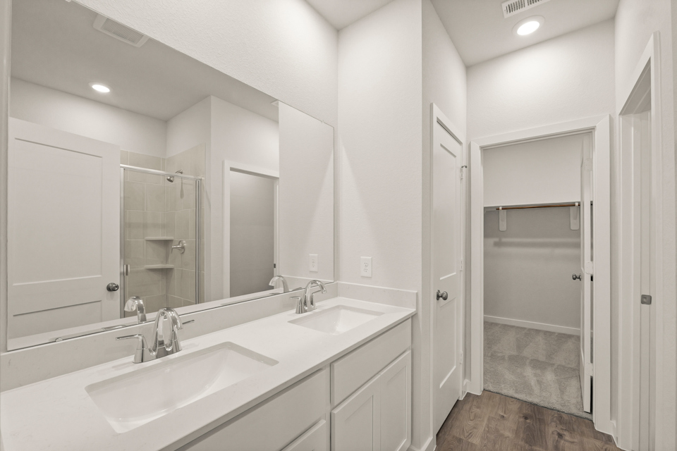 A bathroom with a glass shower.