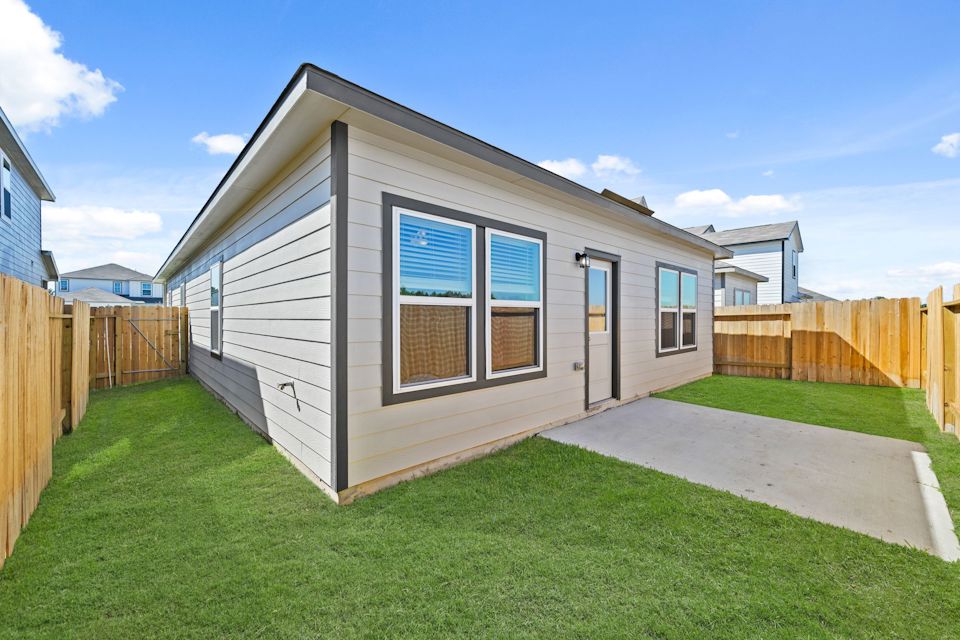 A house with a grass yard.