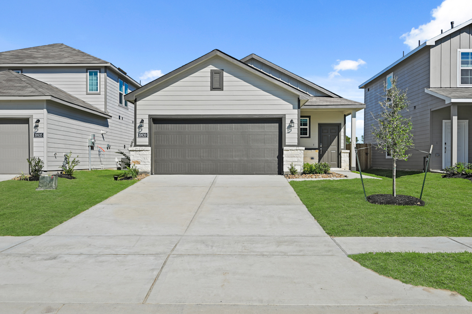 A driveway leading to a house.