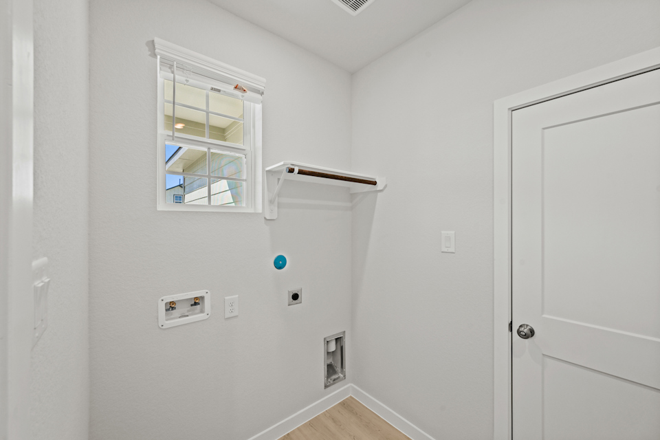 A room with a window and a door.