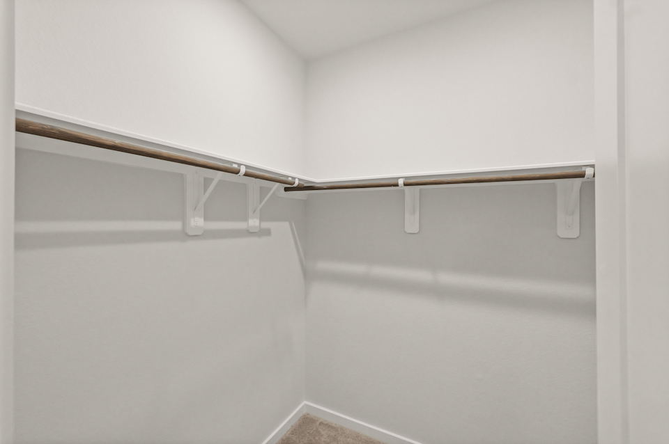 A metal bar on a white wall.