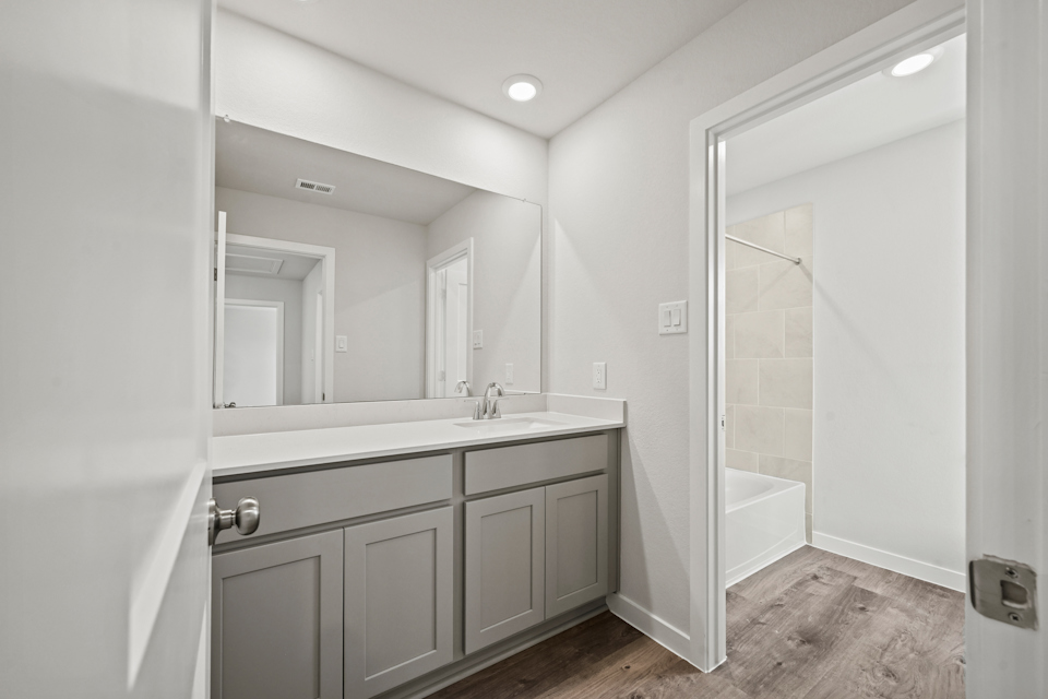 A bathroom with a glass shower.