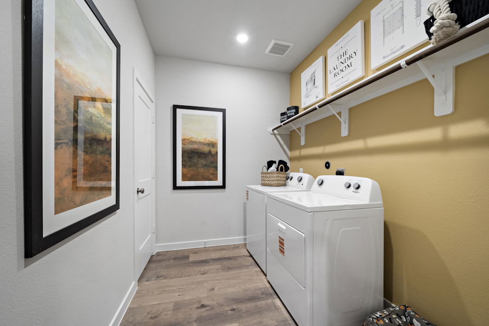 A bathroom with a sink and a washer.