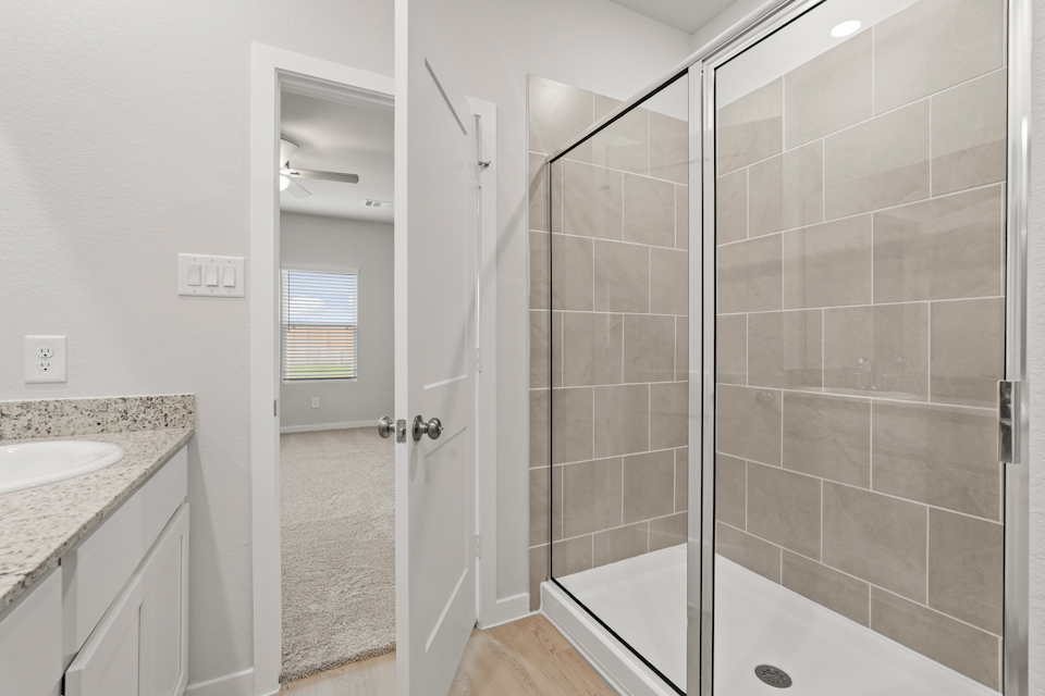 A bathroom with a glass shower.