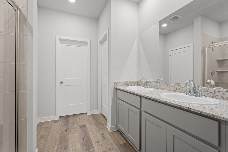 A bathroom with a marble countertop.