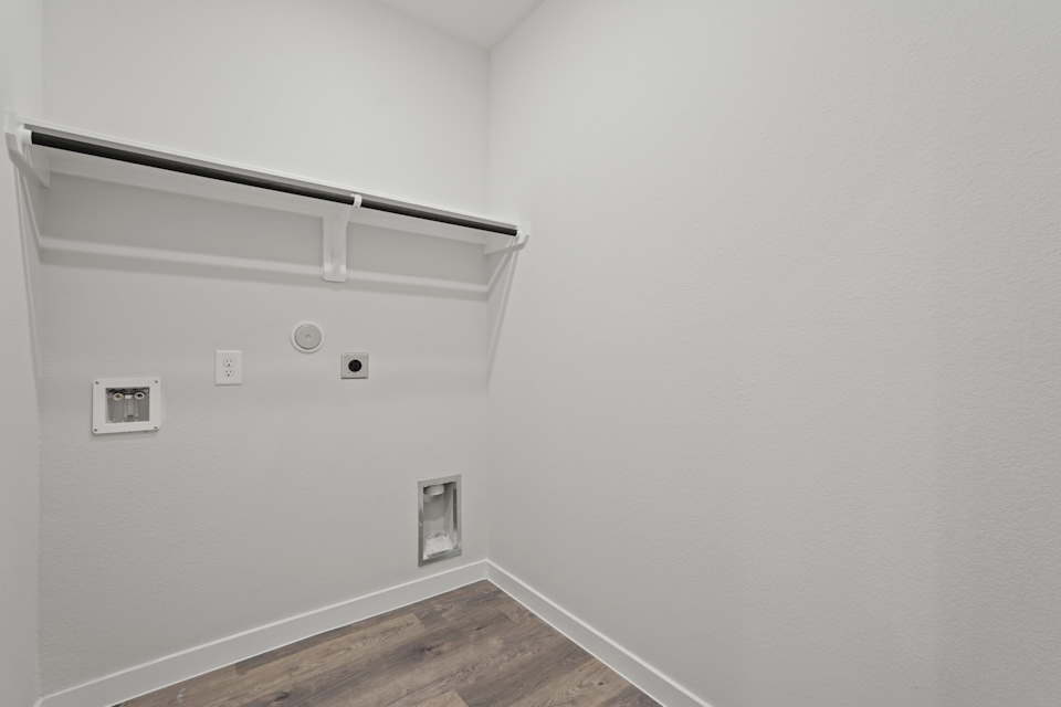 A white wall with a light on it.