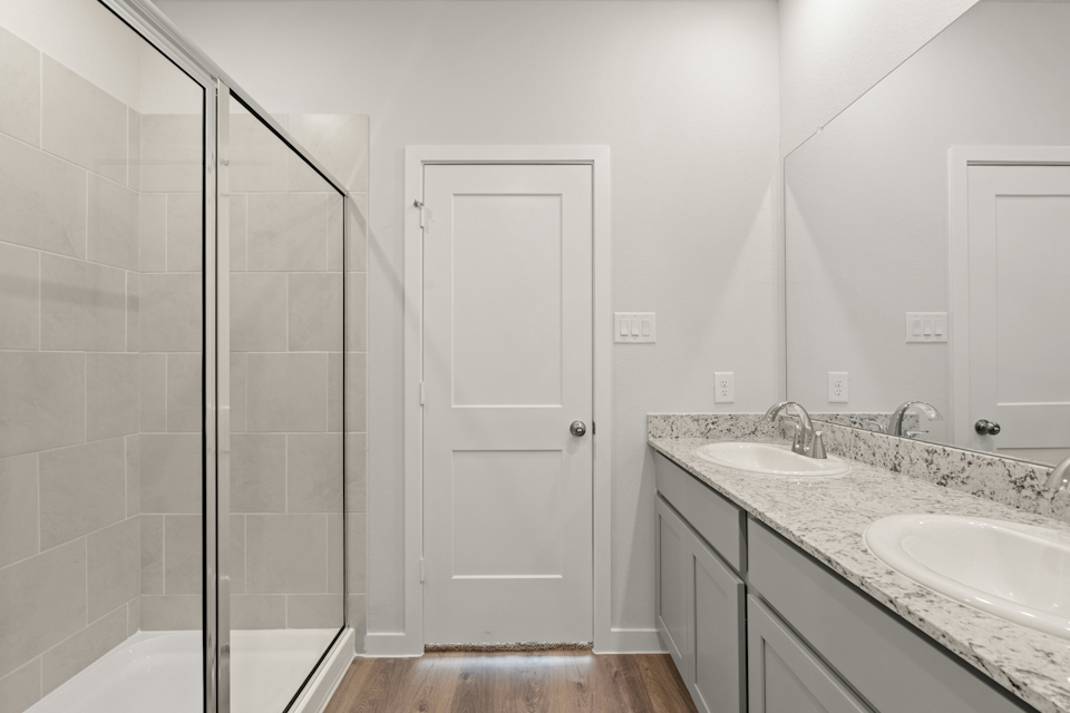 A bathroom with a glass shower.