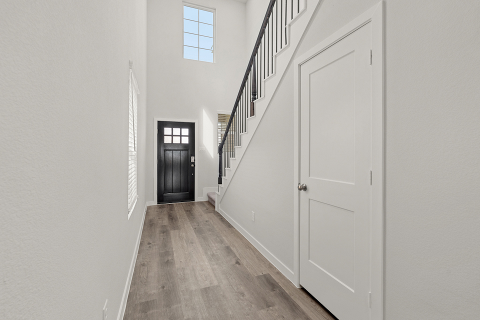 A hallway with white doors.