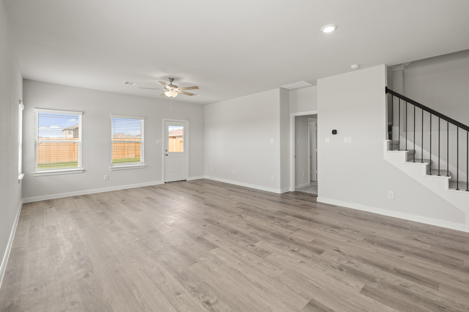 A room with a wood floor and a wood floor.