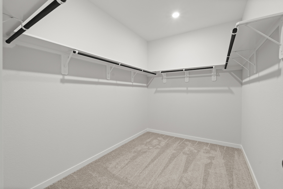 A white staircase with a light.