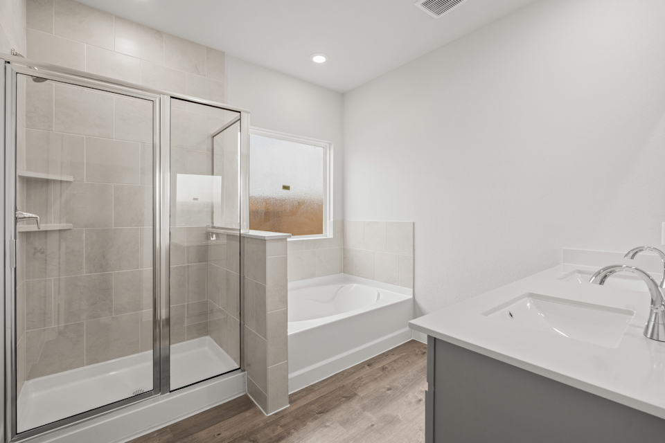 A bathroom with a glass shower.