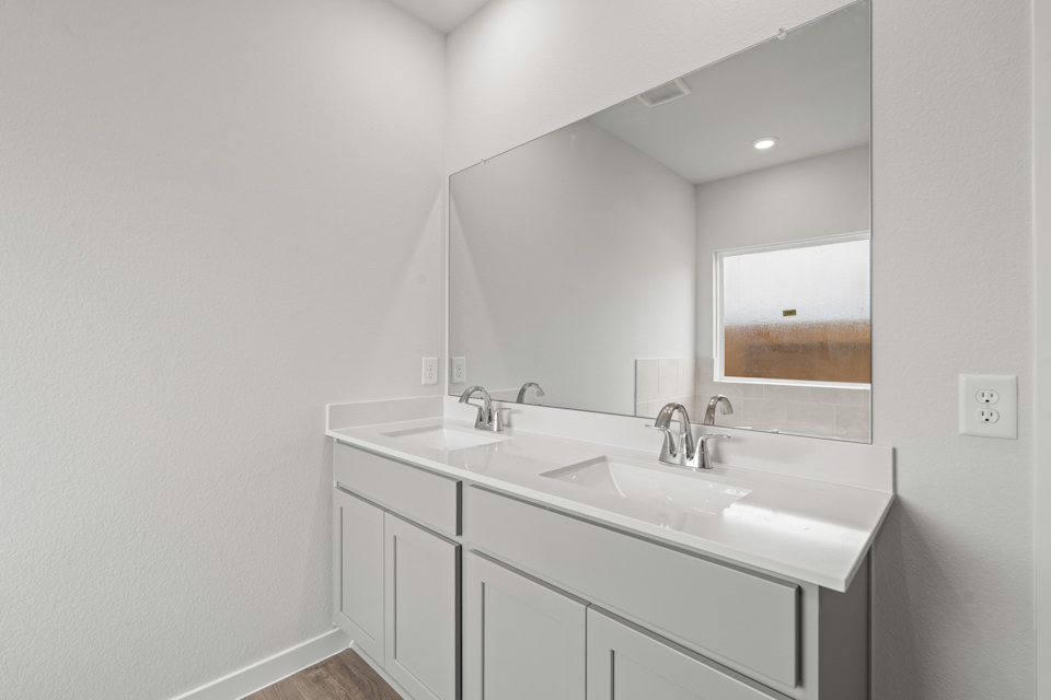 A bathroom with two sinks.