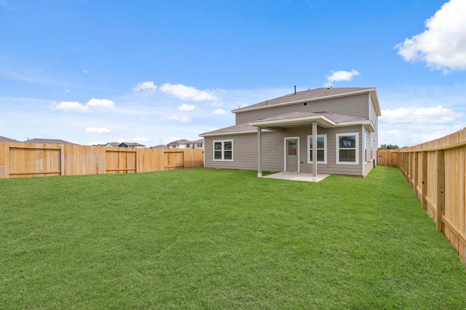 A house with a fence around it.