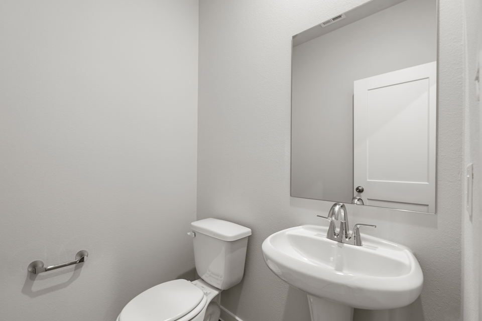 A bathroom with a sink and toilet.