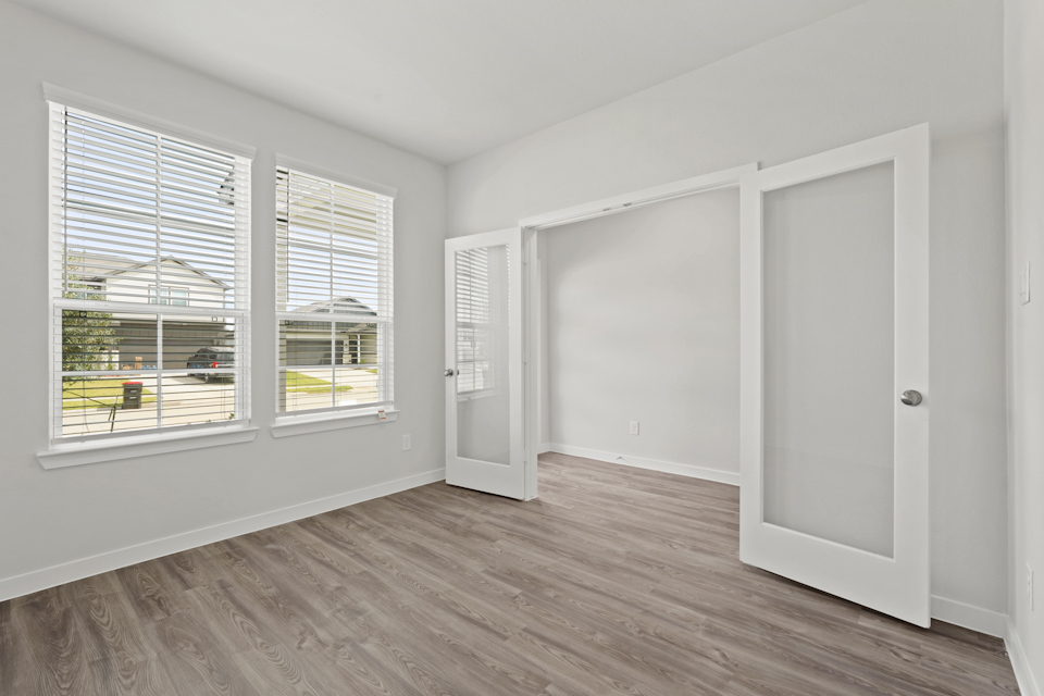 A room with white walls and windows.
