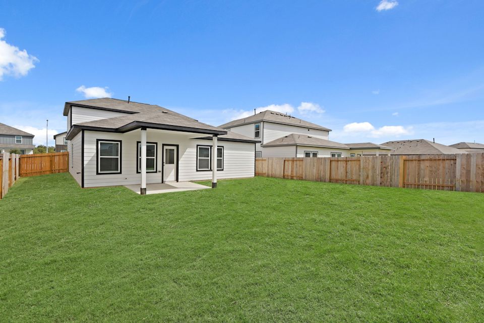 A house with a fence around it.