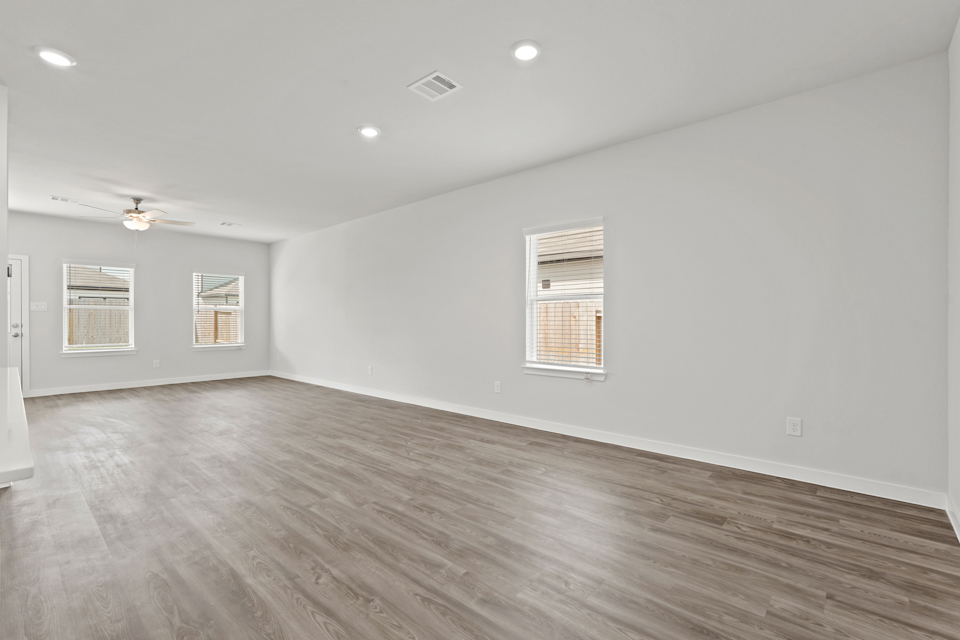 A room with a wood floor and a wood floor.