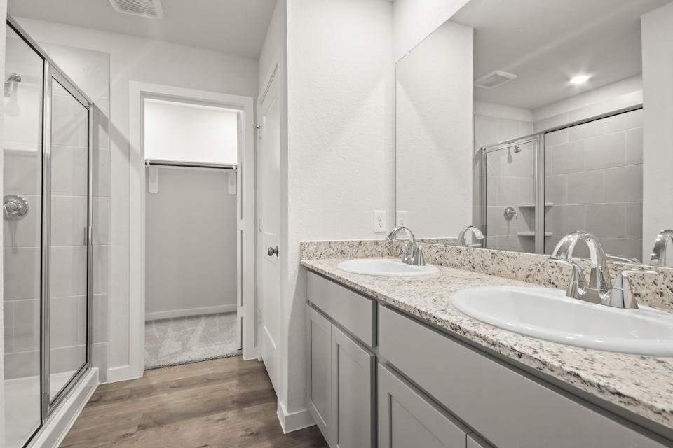 A bathroom with a glass shower.
