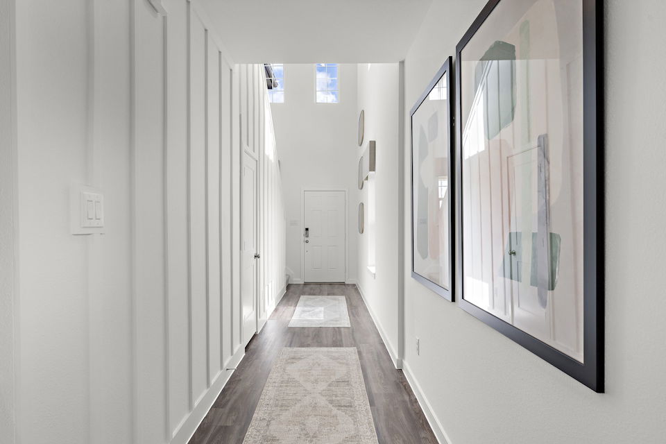 A hallway with white walls.