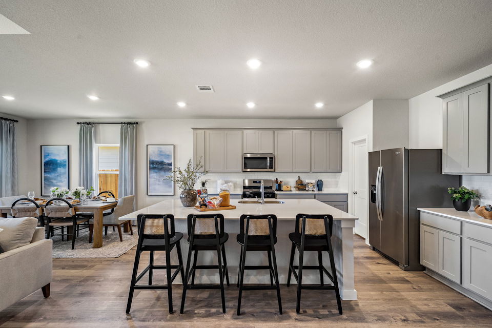 A kitchen with a dining table.