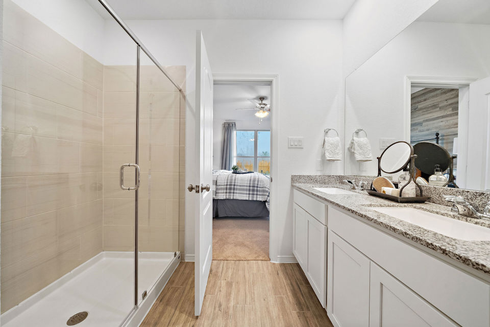 A bathroom with a glass shower.