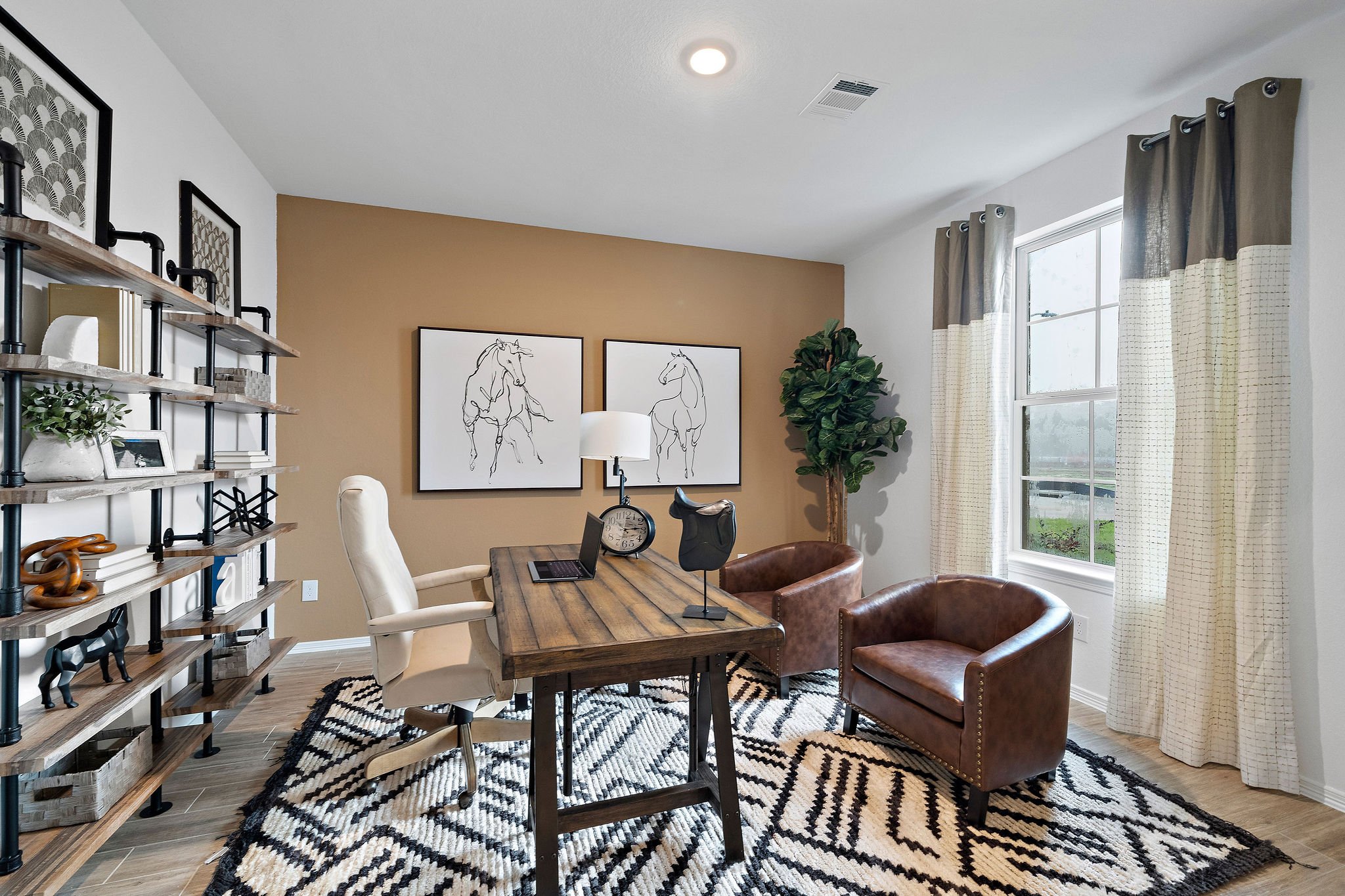 A room with a table and chairs.