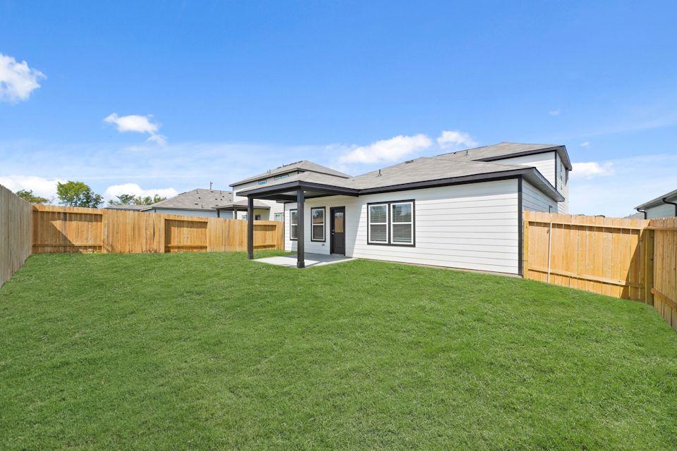 A house with a fence around it.