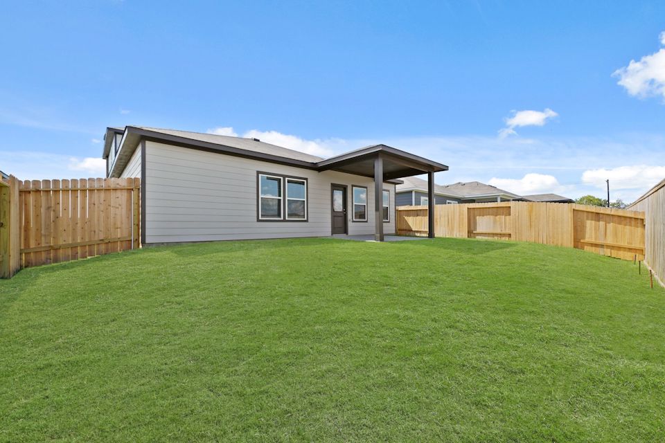 A house with a green lawn.
